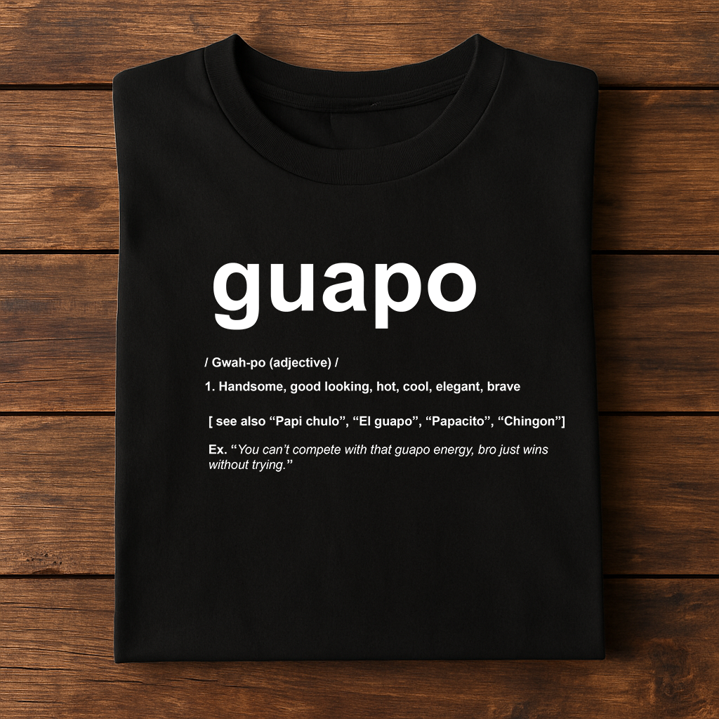 Folded KE CHINGÓN t-shirt with bold design – model Guapo in frame / Playera KE CHINGÓN doblada con diseño impactante – modelo Guapo en escena